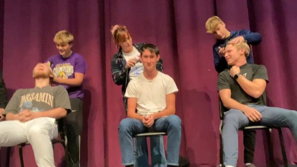 Some of the students who participated getting their head shaved.