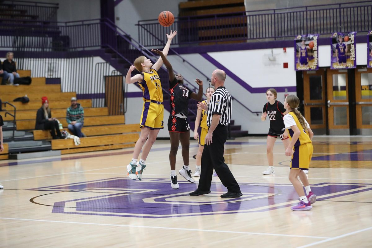 Seventh grader Teya Kemenda tips the ball off.