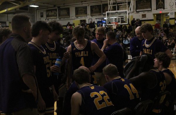 Varsity players listening to what their coach, Dusty Cole has to say.