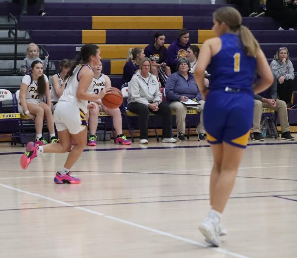 Freshman Kalyn Hannon dribbles the ball down the court.