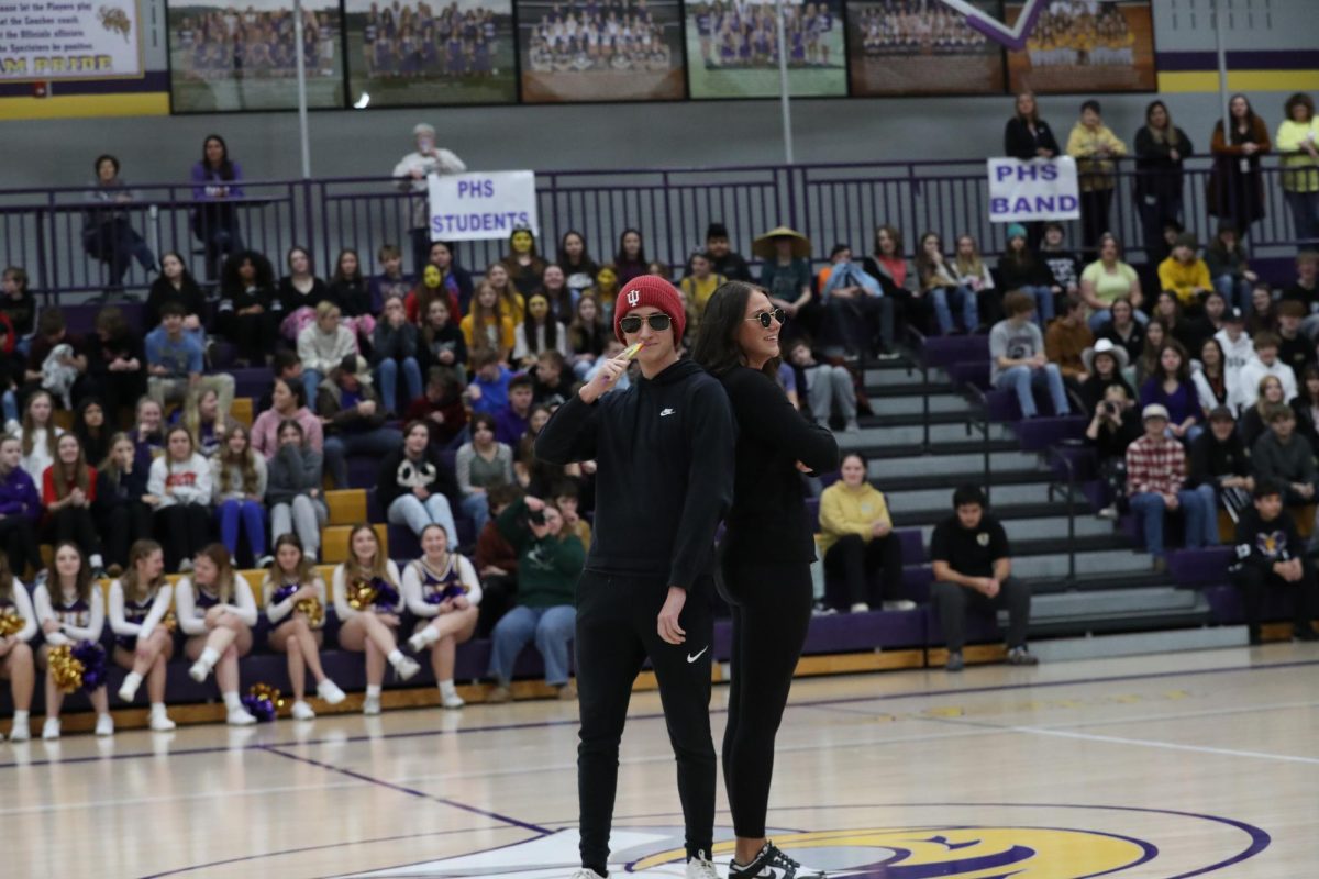 Senior king candidate Brian Fullington and senior queen candidate Jerzie Crane smiling at the crowd.