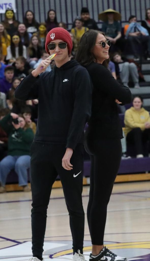 Senior king candidate Brian Fullington and senior queen candidate Jerzie Crane smiling at the crowd.