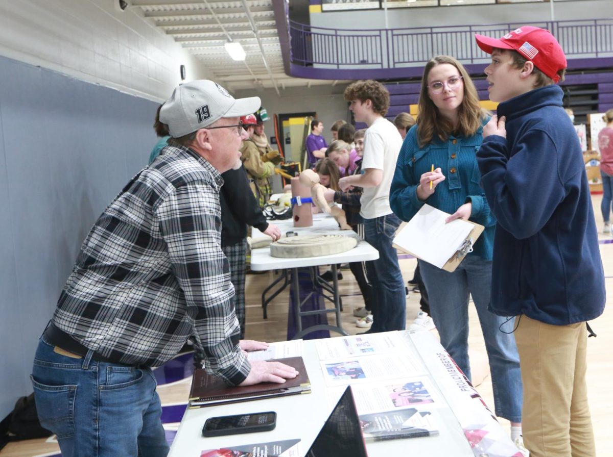 Eighth grader Hayden Higdon talking to an instructor.
