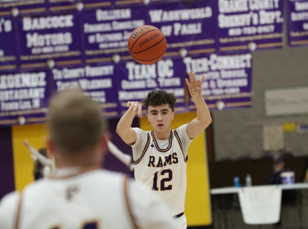 Junior Kirk Hughes makes a pass in the game against North Harrison.