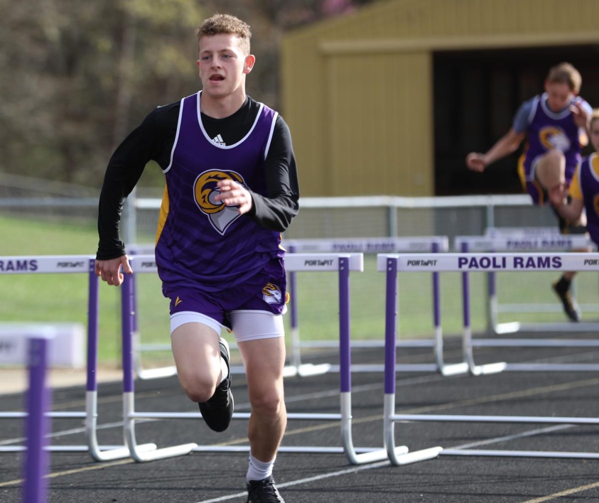 Junior High Finnley Cole runs on the track.
