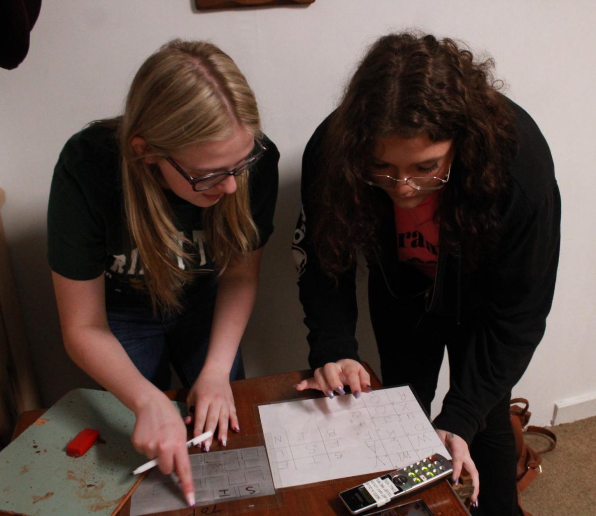 Senior Paige Flick and Junior Sirinity Anderson work together to find clues.