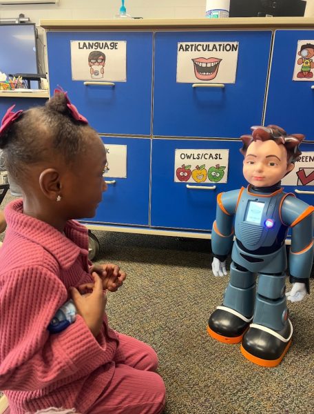 A Throop student engages with the Robokind robot during class time. 