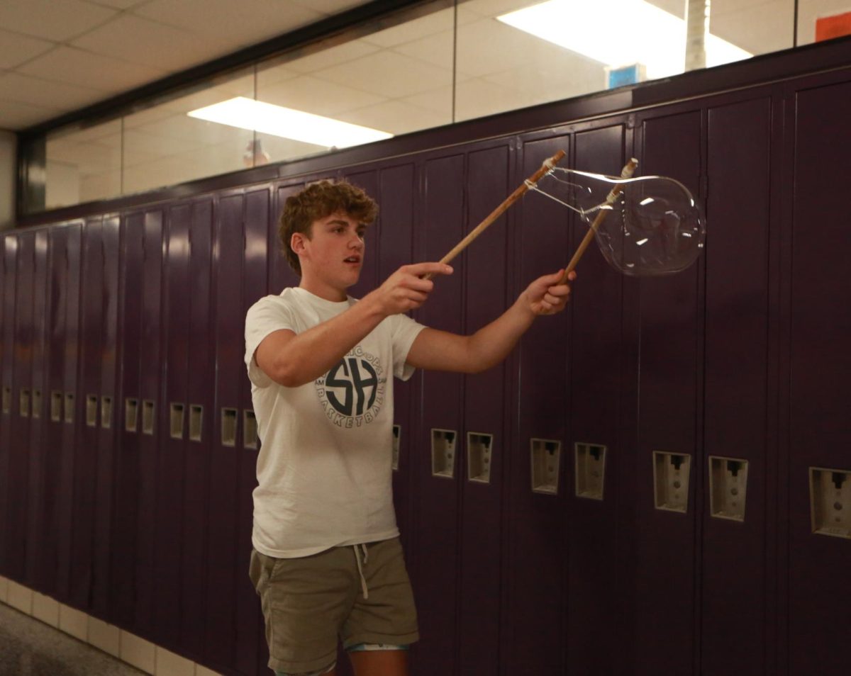 Freshman Carter Vernon makes a bubble.