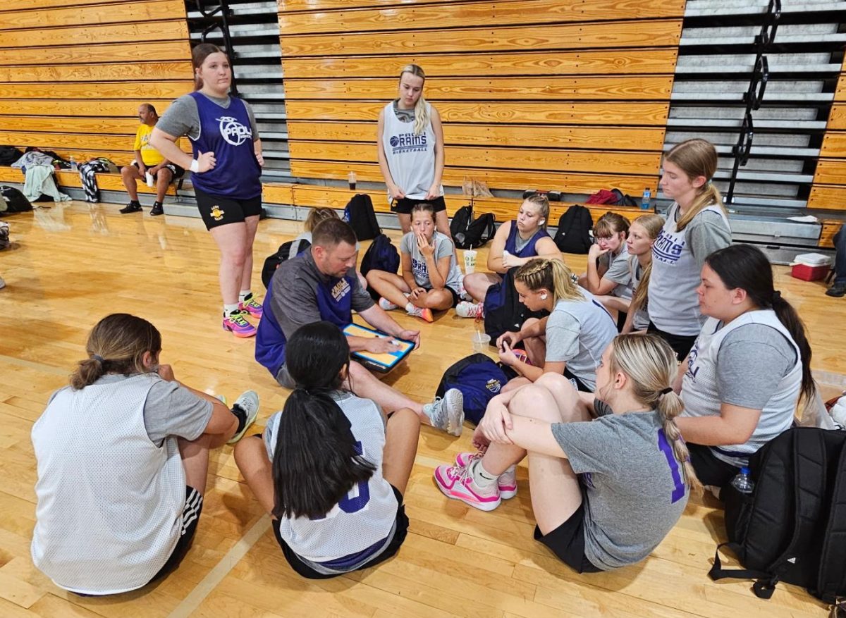 Coach Key talks to the Lady Rams during a summer game.