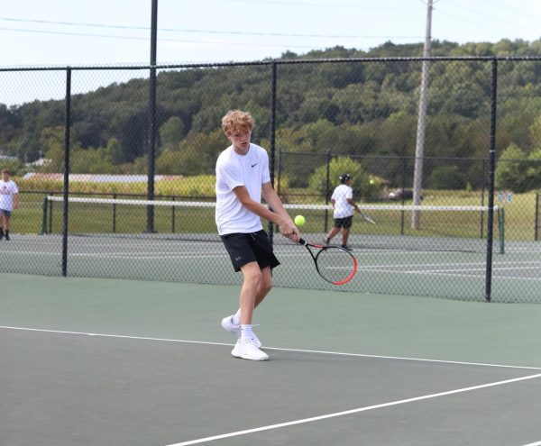 Eighth Grader Owen Sullivan get ready to hit the ball.