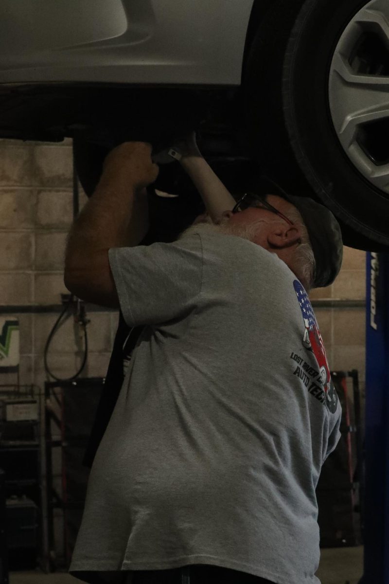 Automotive teacher Ronnie Hopper teaches students.