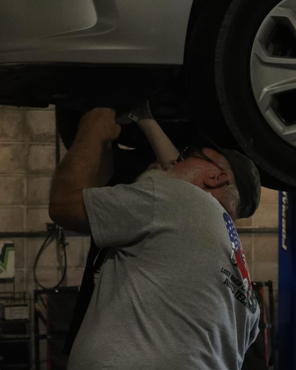 Automotive teacher Ronnie Hopper teaches students.