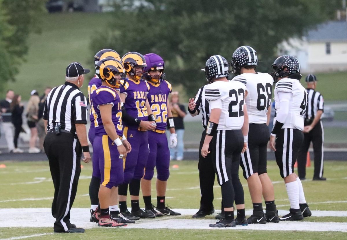 Seniors Tyler Hannon, Dane Padgett, Cooper Spires, and Coen Brace represent the Varsity Football team as team captains against Springs Valley.