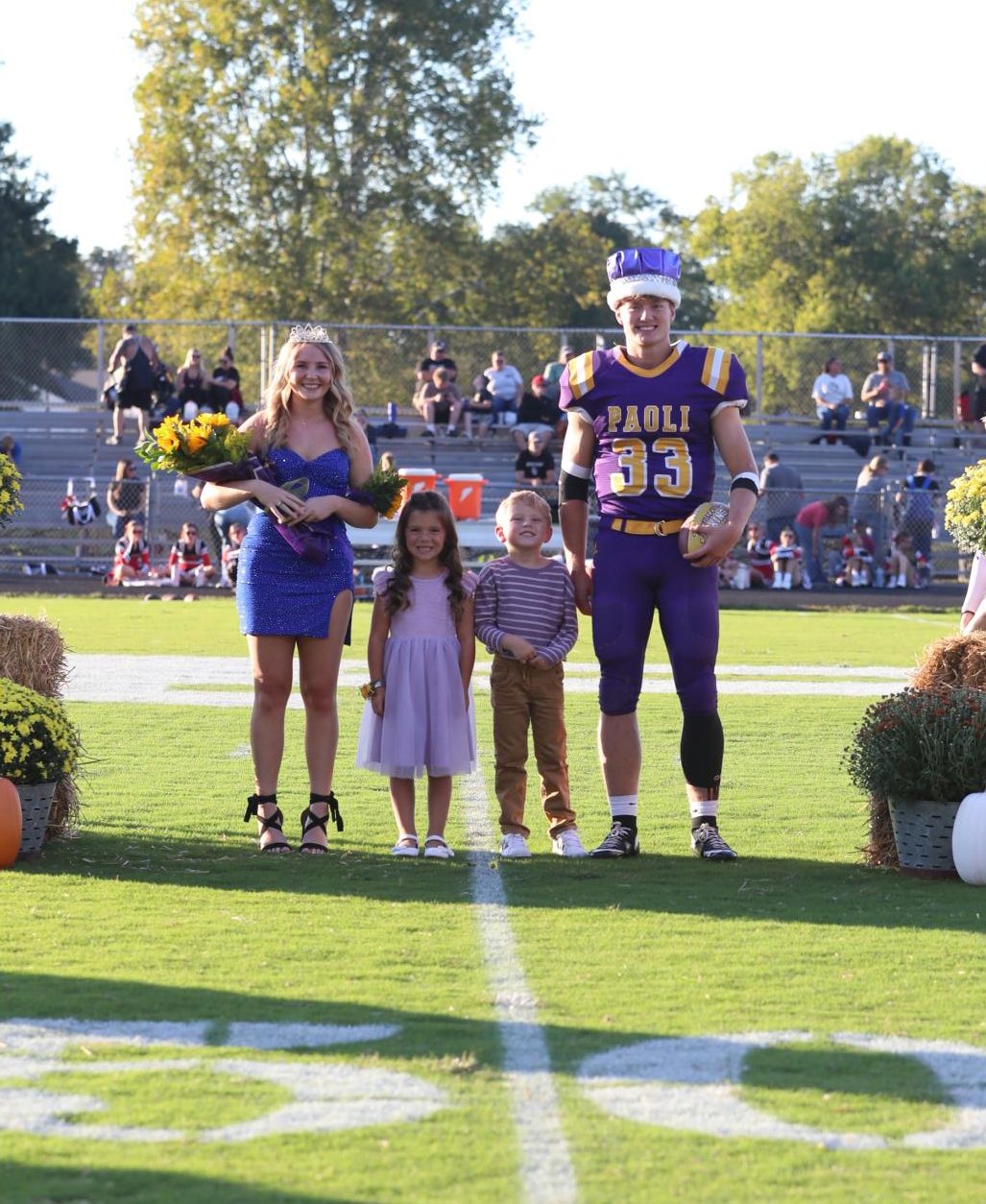 Queen Abby Poe and King Dane Padgett pose with Capri Santa and Sloane Dillard
after being crowned.