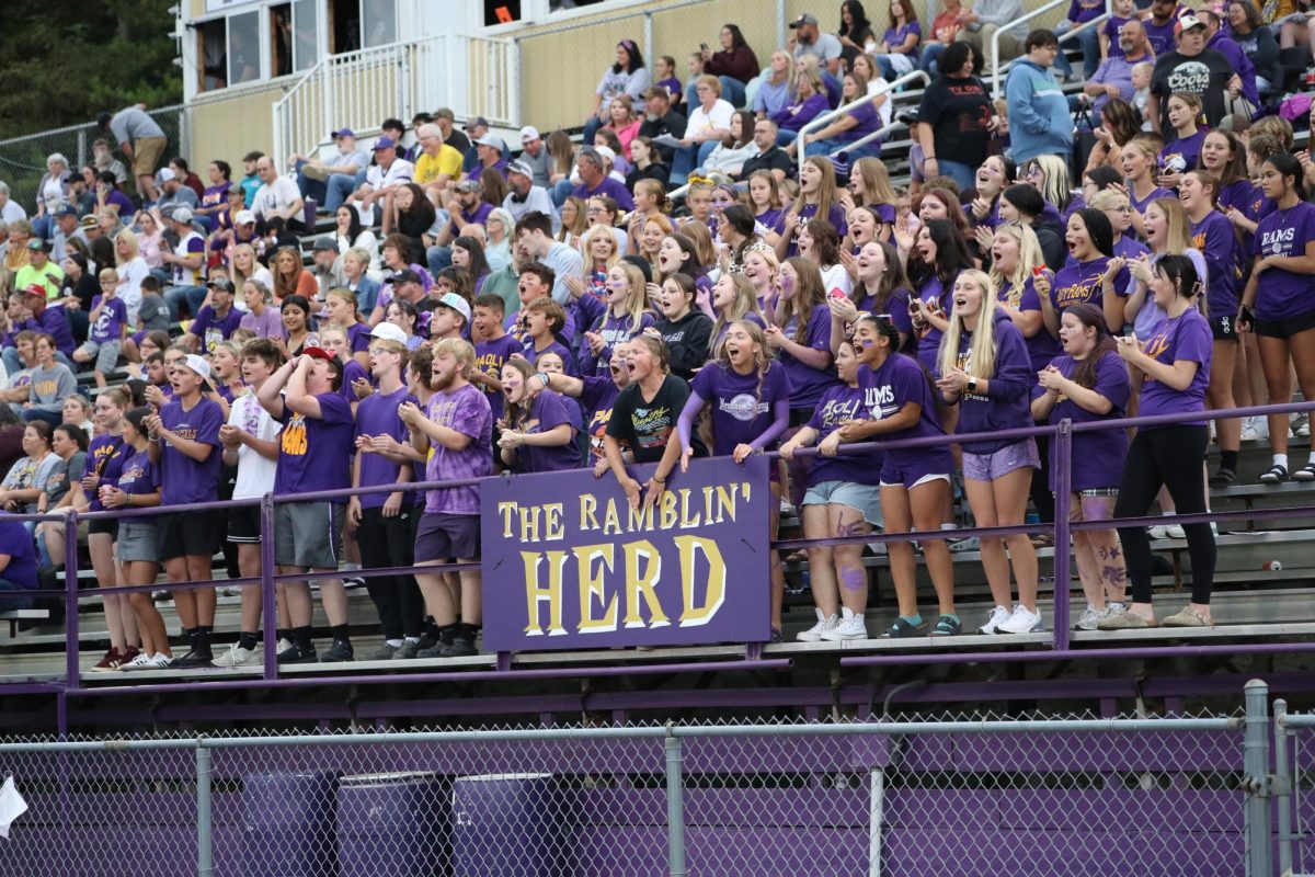 The Booster Club cheers on the Rams.