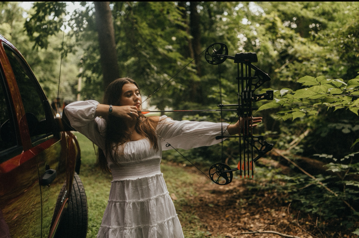 Charli Chastain poses with her bow.