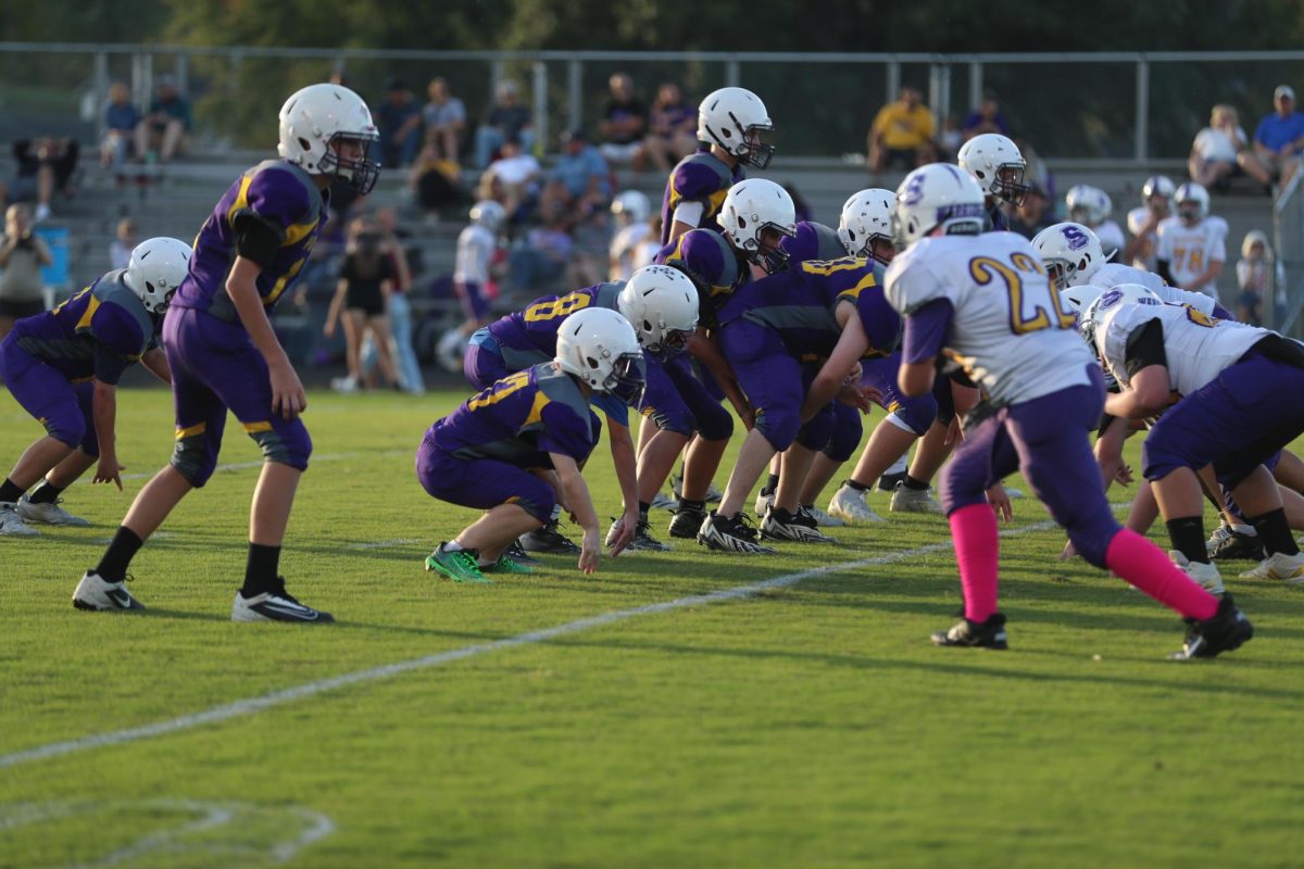 7th grader Houston Rodeman takes the snap.