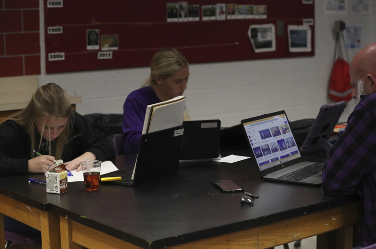 Teacher Chris Jones works with his students.