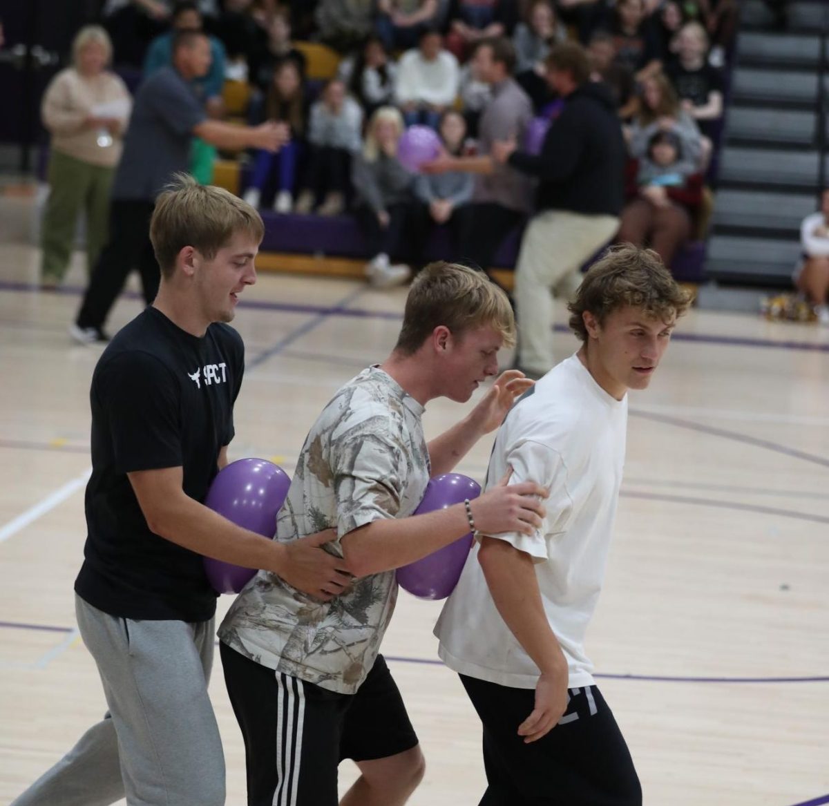 Seniors Cooper Spires, Kolt Bonta, and Kade Walls battle to win the race.