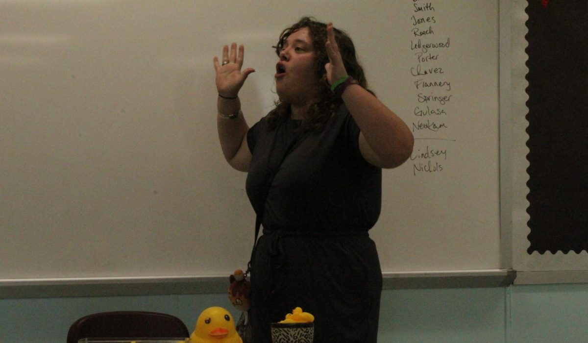 Sophomore Emily Lindsey presents her humorous monologue for the speech contest.