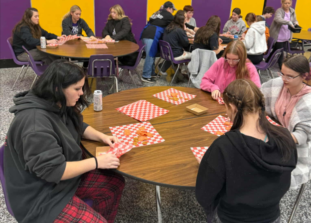 (Above) Junior Kyrah Fry, sophomore Madison McCauley, junior Taylor Cole, and senior Trinity Turner create charcuterie boxes at the first Ratatouille Rams meeting on November 13.