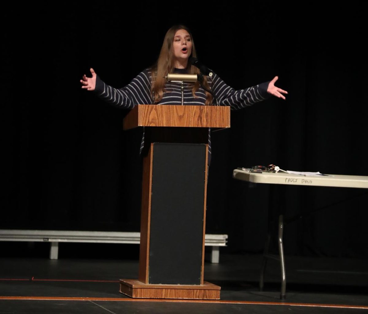 Junior Frank performs her original speech during the awards convocation for the school.