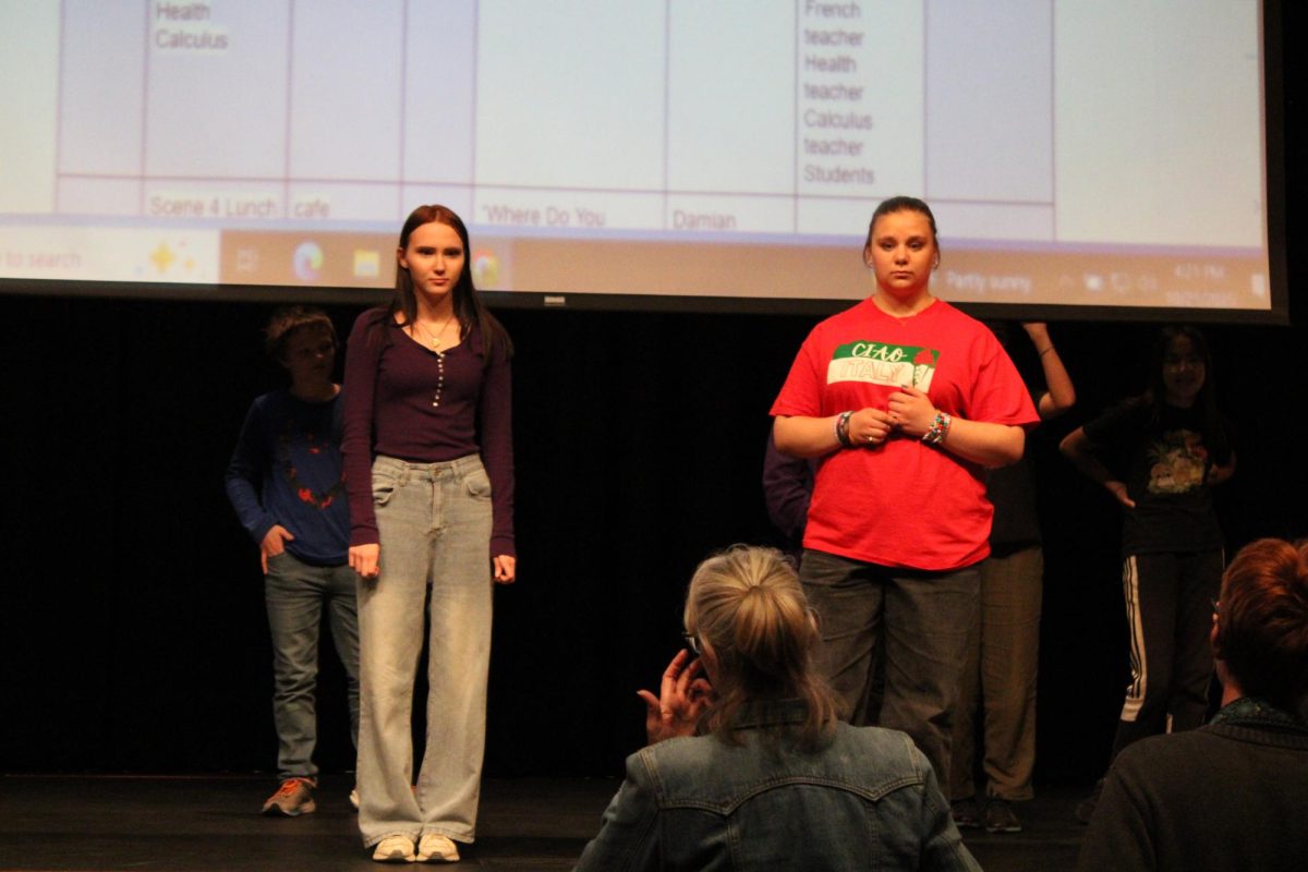 Senior Trinity Turner and junior Piper Frank rehearse with Director Maria Wishart for their roles in the fall musical. Turner plays Regina George and Frank plays Cady Heron.