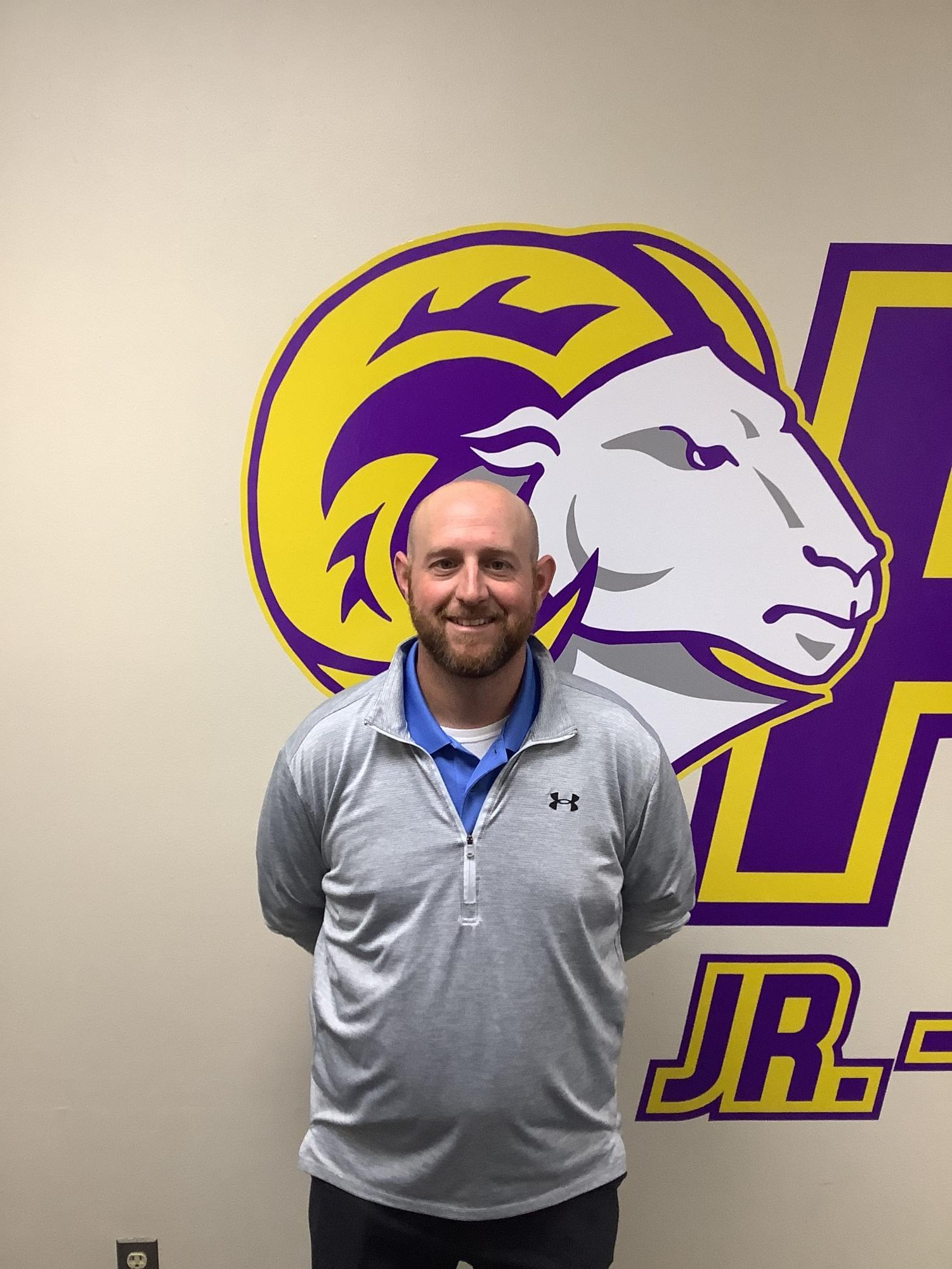 Neil Dittmer posing for a photo after finding out he was selected for Dean of Students. 