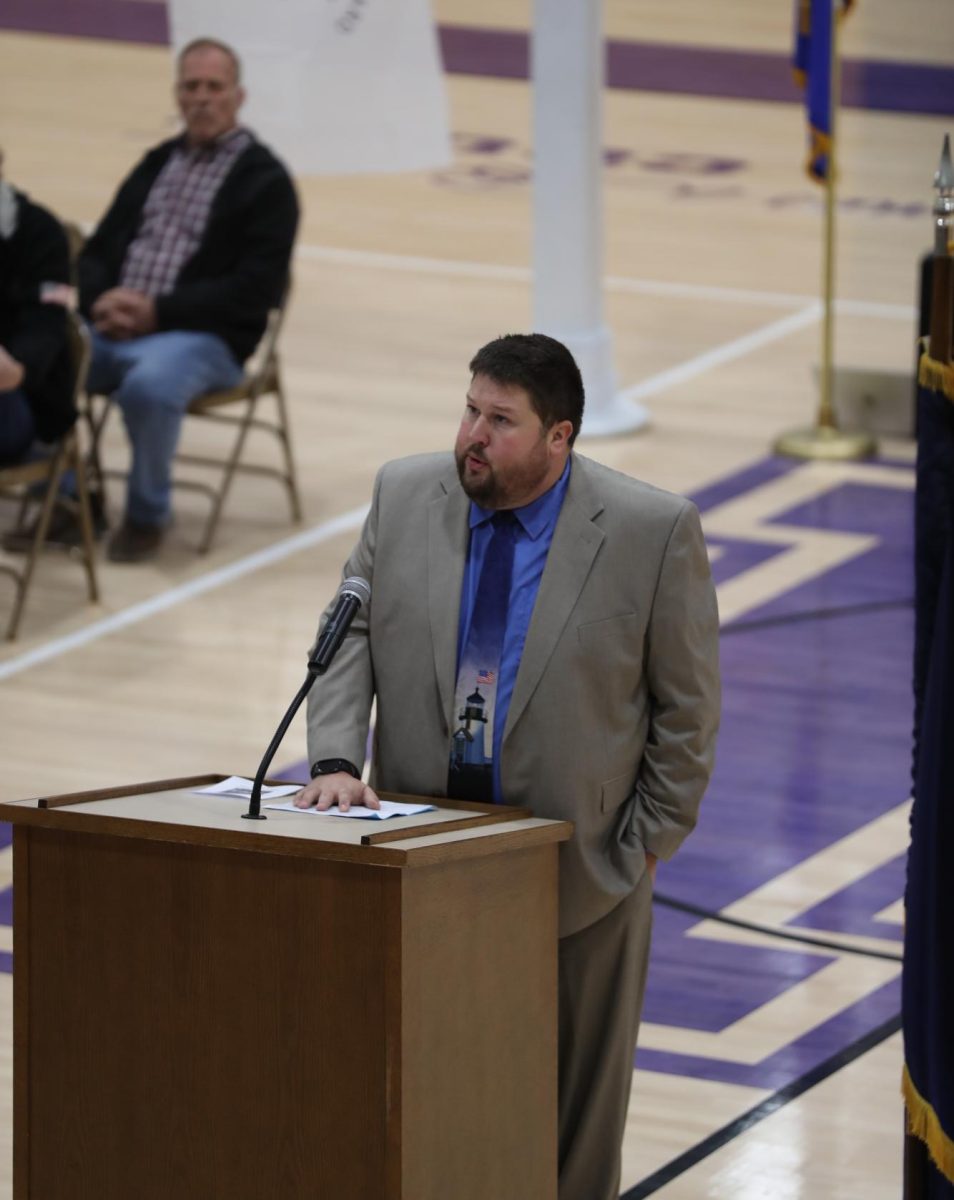 Assistant Principal Adam Stroud announces the Indiana Purple Star honor at Veterans Day.
