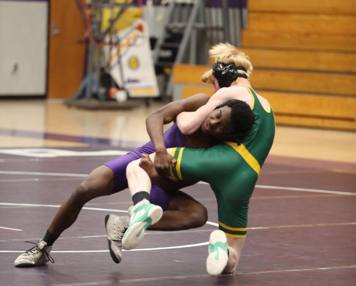 Sophomore Moise Hall takes down the opponent.
