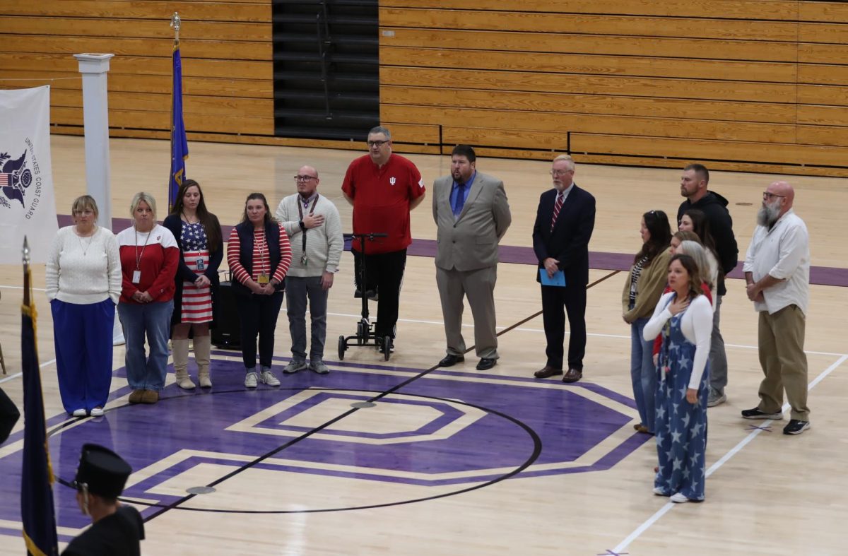 PHS staff members lead the National Anthem.