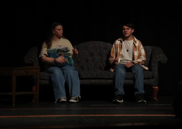 Juniors Piper Frank and Josh Young sing to each other.