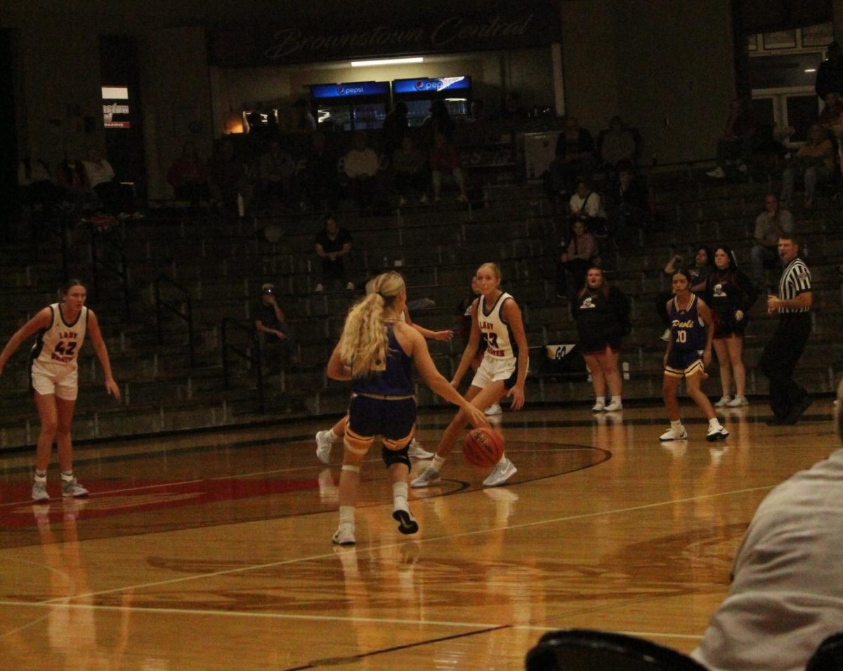 Senior Maddie Vernon dribbles the ball.