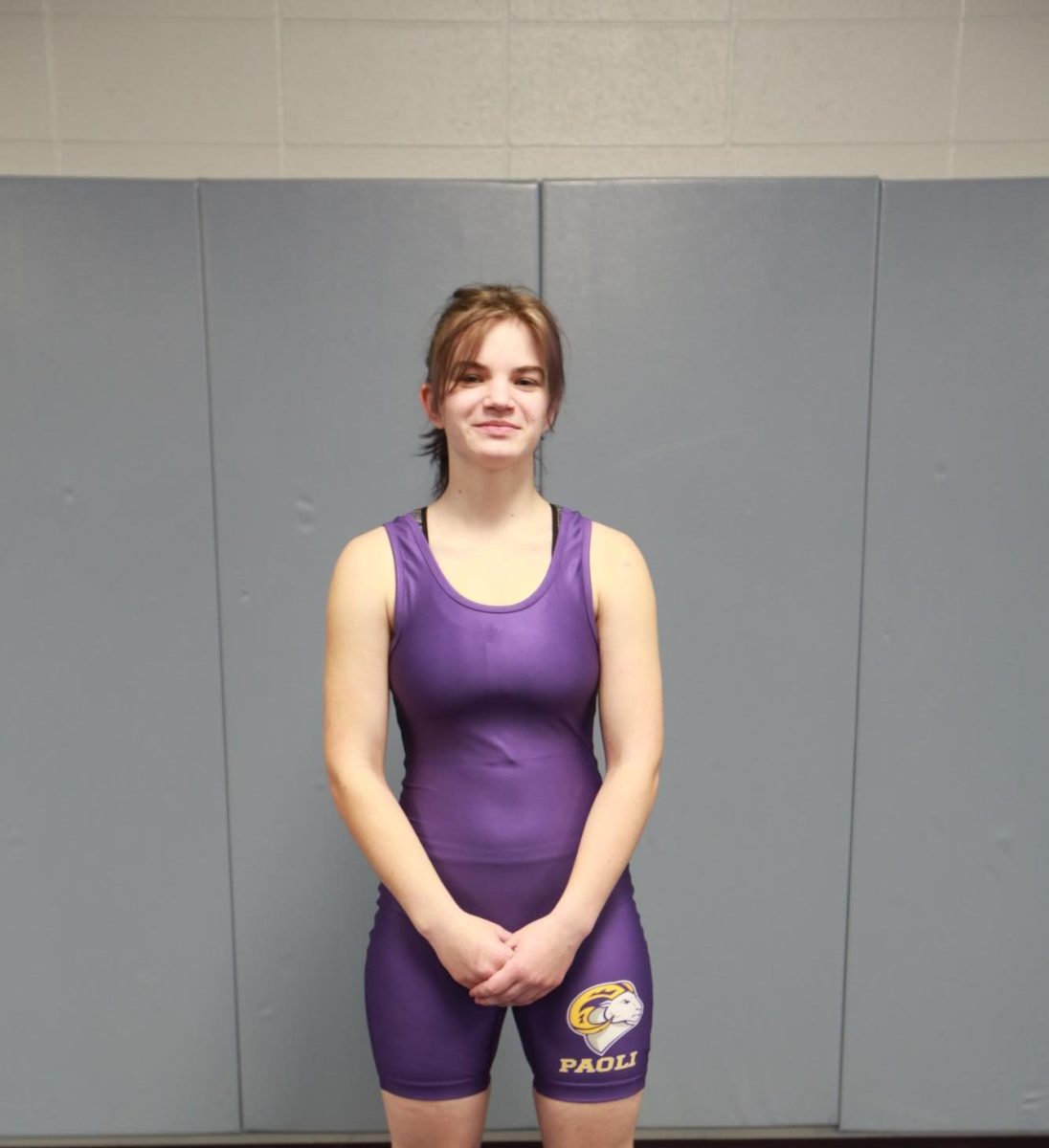 Lidianna Davenport poses in her wrestling uniform.