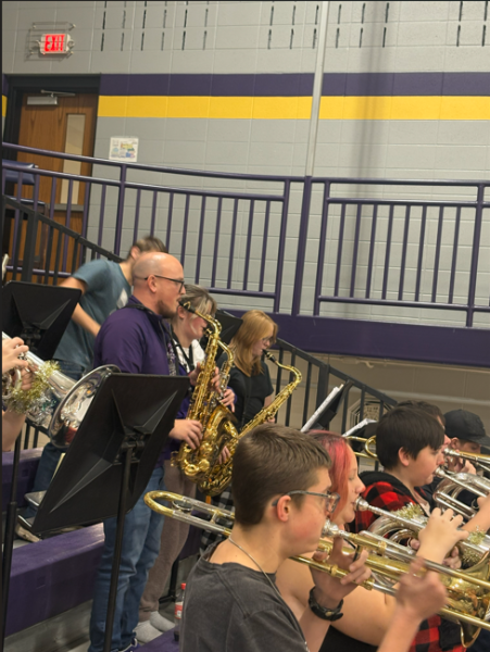 Band Director Christian Karkosky plays his saxophone.