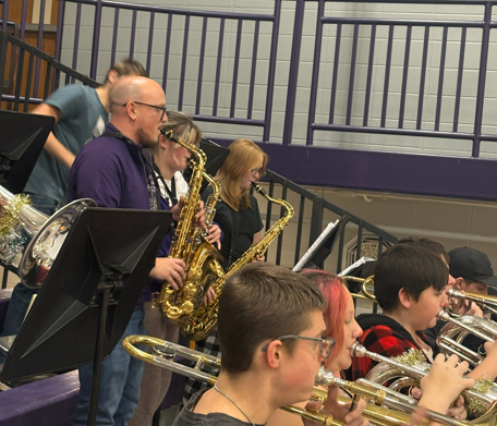 Band Director Christian Karkosky plays his saxophone.