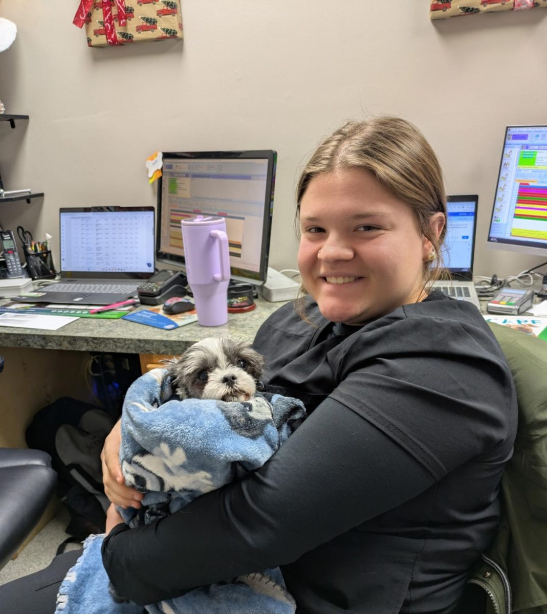 Gracielynn McKibbon holds a dog being treated at the local clinic.

(Photo Courtesy Gracielynn Mckibbon)