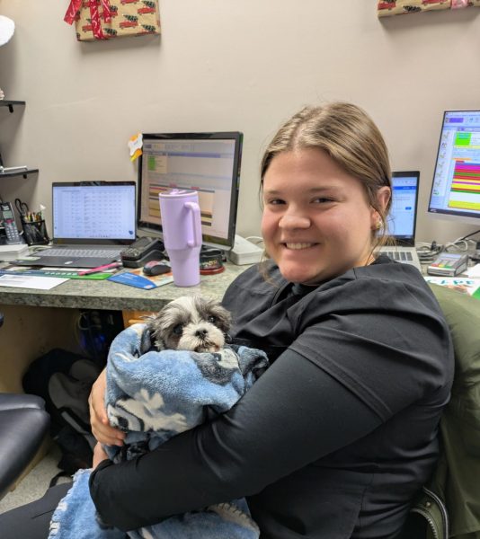 Gracielynn McKibbon holds a dog being treated at the local clinic.
(Photo Courtesy Gracielynn Mckibbon)
