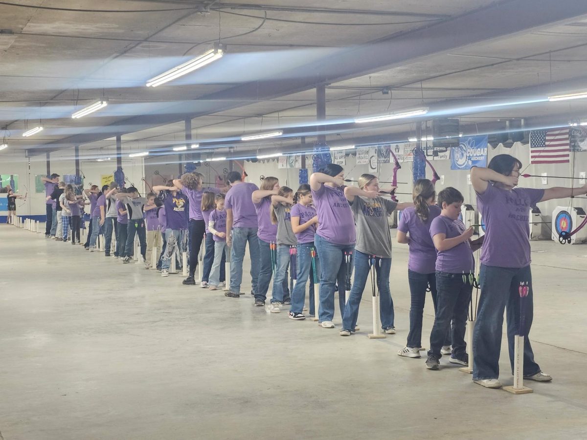 Members of the Paoli Archery Team stand at the line taking their shots to earn a spot at the State Contest in March.