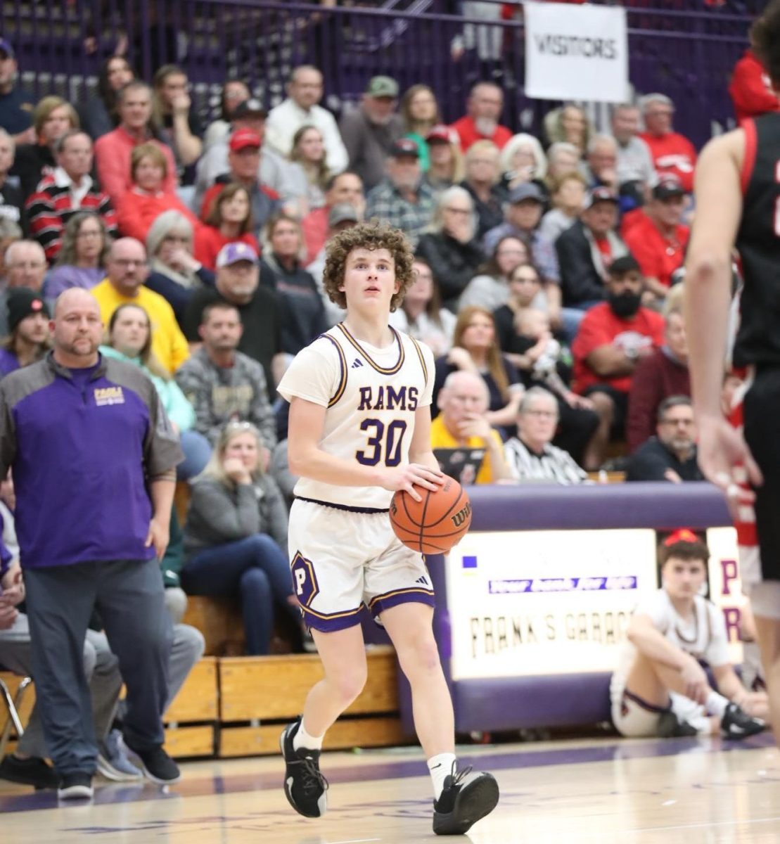 Junior Dakota Apple brings the ball down the court to try to score.