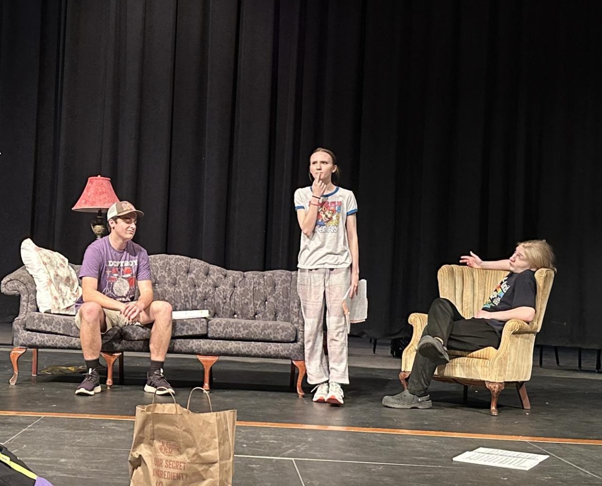 Seniors Cannon Lambdin and Trinity Turner and sophomore Havoc Nichols practice a scene.