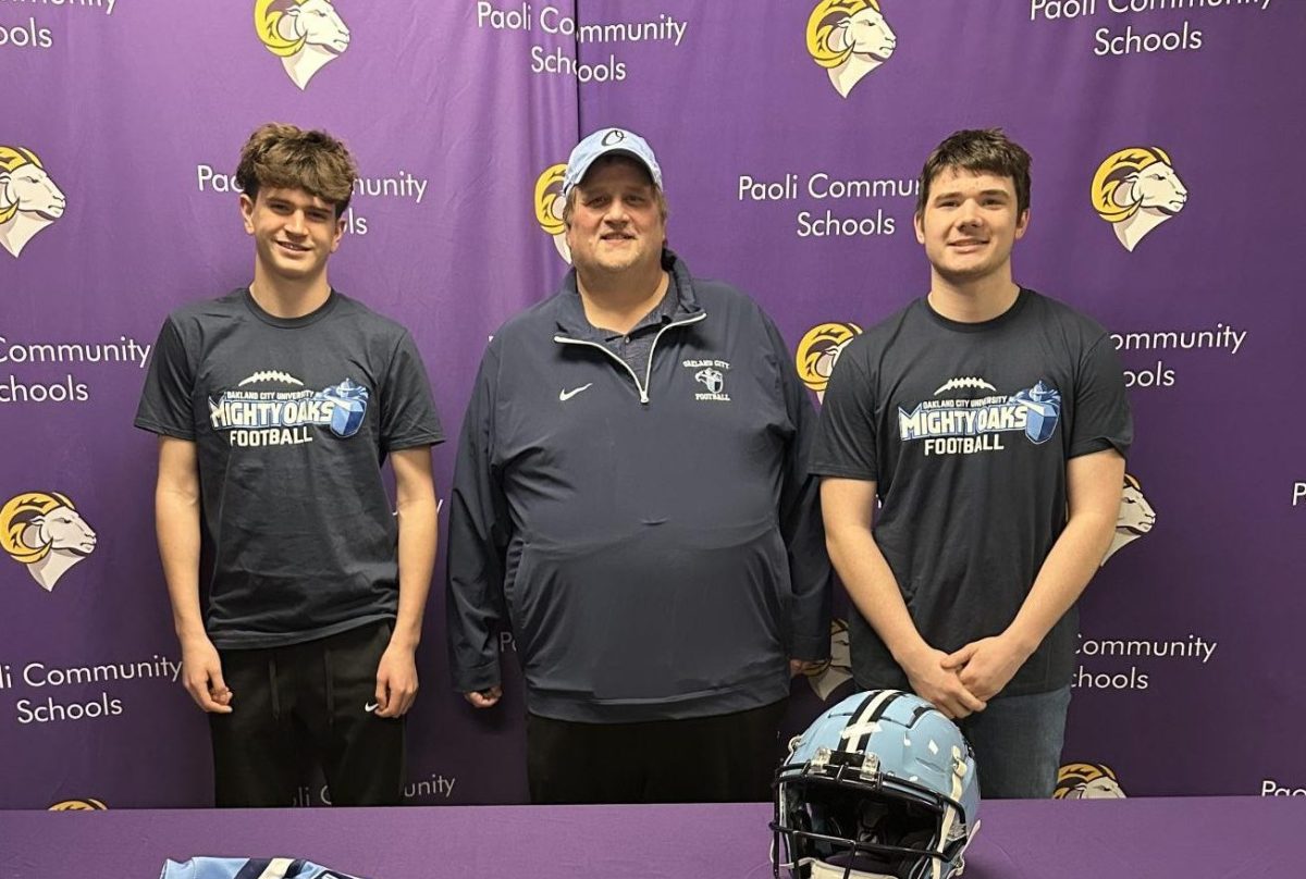 Seniors Colton Baechle and Lucas Shinkle pose with their new Oakland City Coach, Scott Hurst.