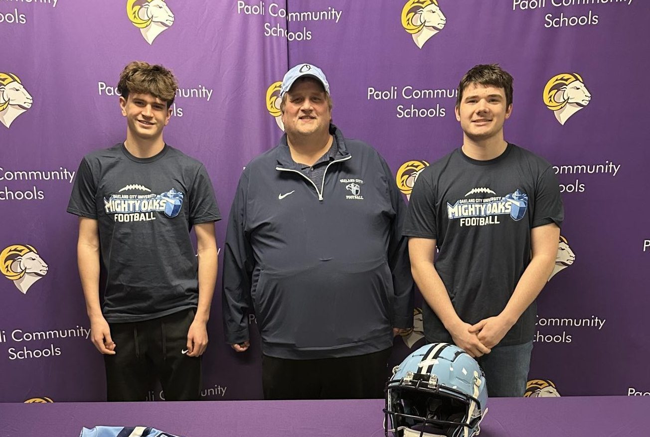 Seniors Colton Baechle and Lucas Shinkle pose with their new Oakland City Coach, Scott Hurst.