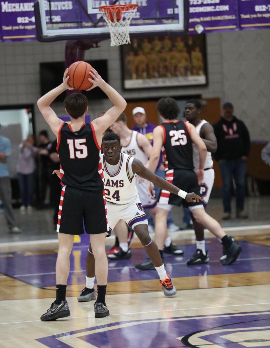 Junior Ian Sullivan eyes an Orleans player.