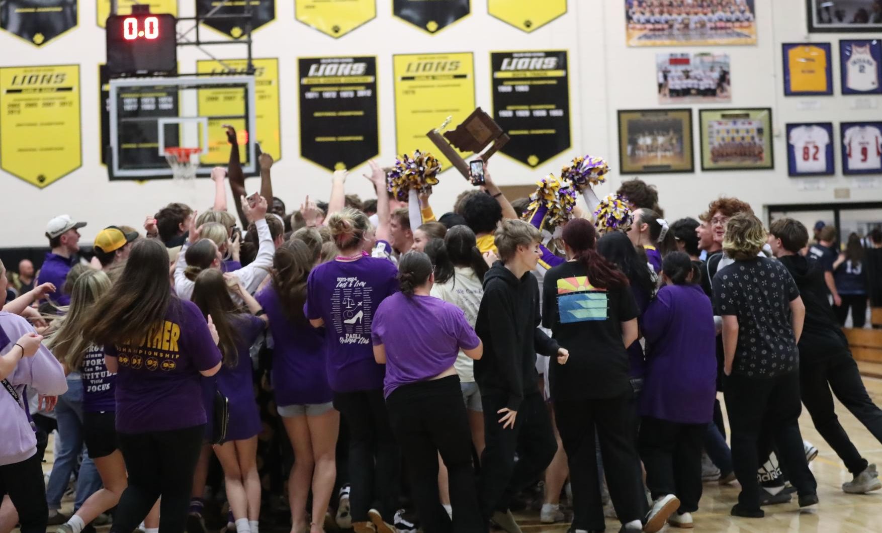 Fans storm the court after the Rams defeated the Providence Pioneers for the Sectional Championship.