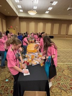 Girls at the Empowerment
Conference are featured packing baggies
of food.